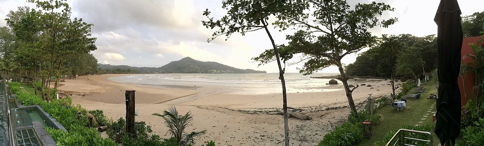 Wide view of Kamala Beach and its green hillside